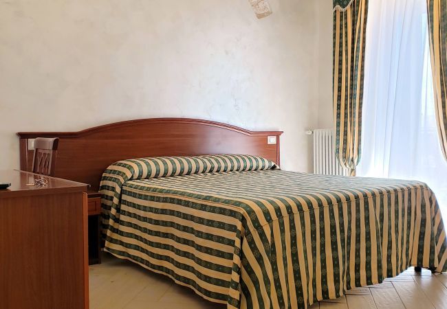 Camera da letto Dimora Arco 1- Affitti Brevi Italia Camera da letto Dimora Arco 1- Affitti Brevi Italia