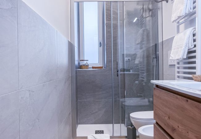 Modern bathroom with double shower, sanitary ware, bidet and cabinet for personal effects. Modern bathroom with double shower, sanitary ware, bidet and cabinet for personal effects.