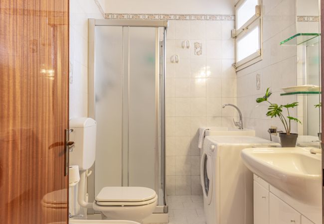 bathroom with shower and washing machine bathroom with shower and washing machine