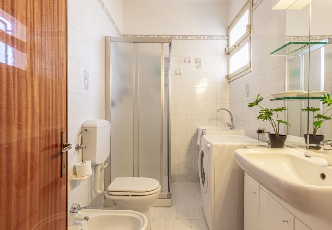 bathroom with shower and washing machine bathroom with shower and washing machine