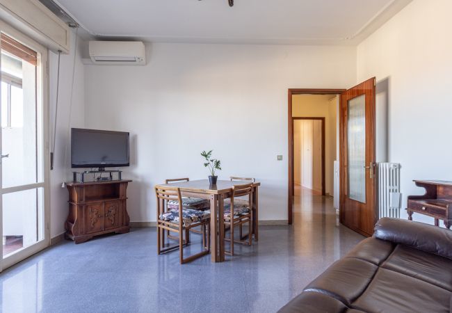 large and bright living room with tv, a/c and balcony large and bright living area with tv, a/c and balcony