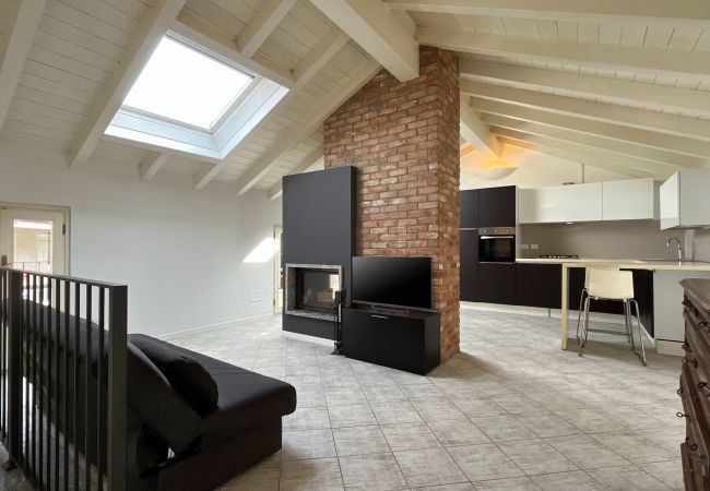 Elegant and bright living room with balcony access and bathroom  Bright open-plan living room