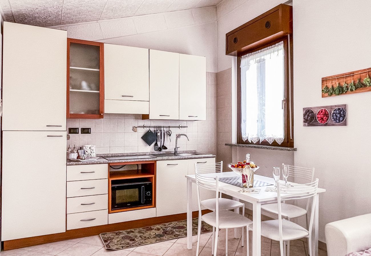 Modern and Bright Kitchenette: Microwave Oven, Induction Hob, Air Conditioning and Independent Heating Modern kitchenette on bright living room with microwave oven, induction hob, table for 4 people, large windows, air conditioning and independent heati