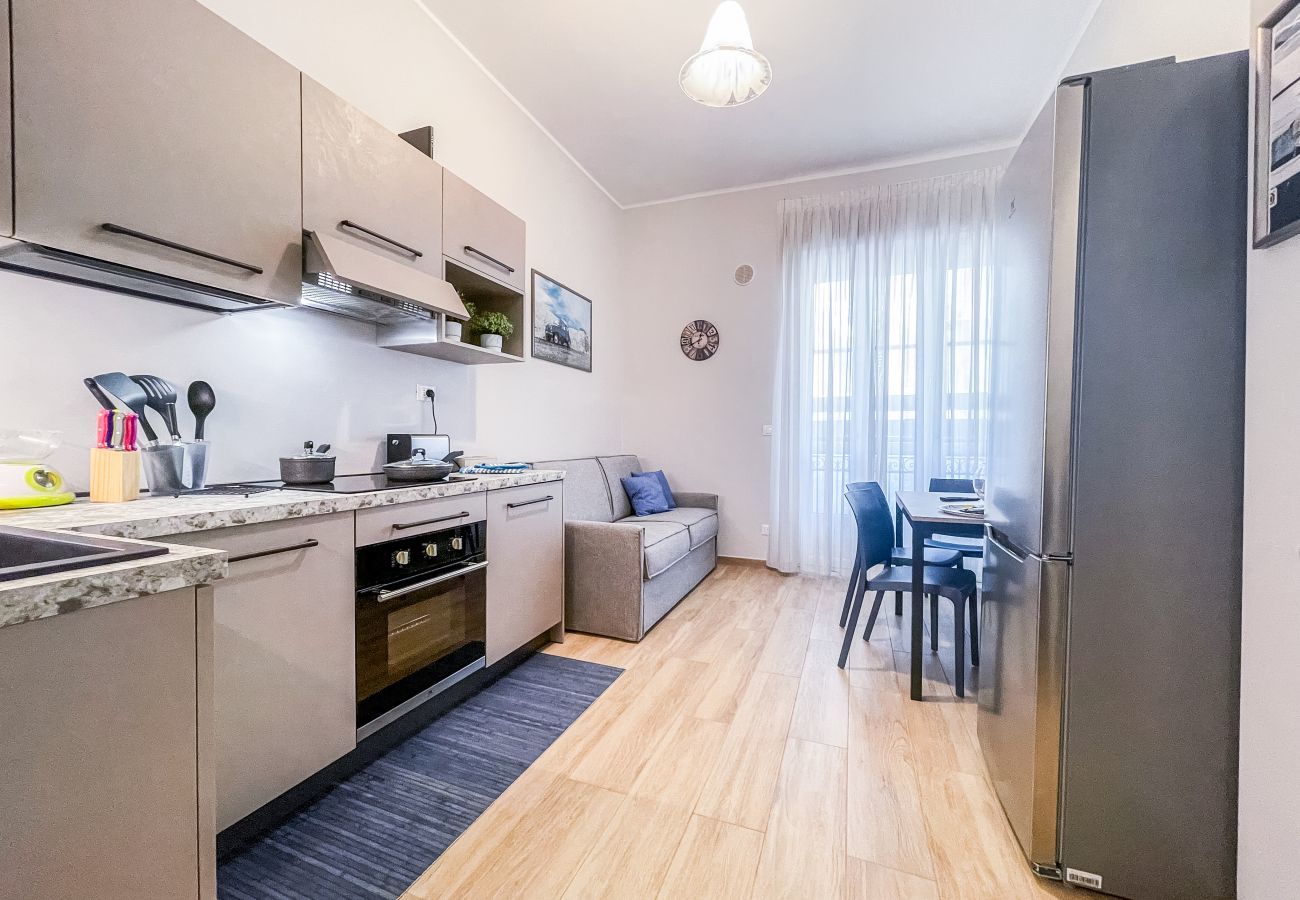 Living room with kitchenette and comfortable sofa bed. Living room with kitchenette and comfortable sofa bed.