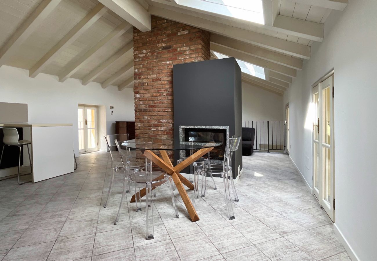 Bright dining area with glass table and skylight Bright and elegant