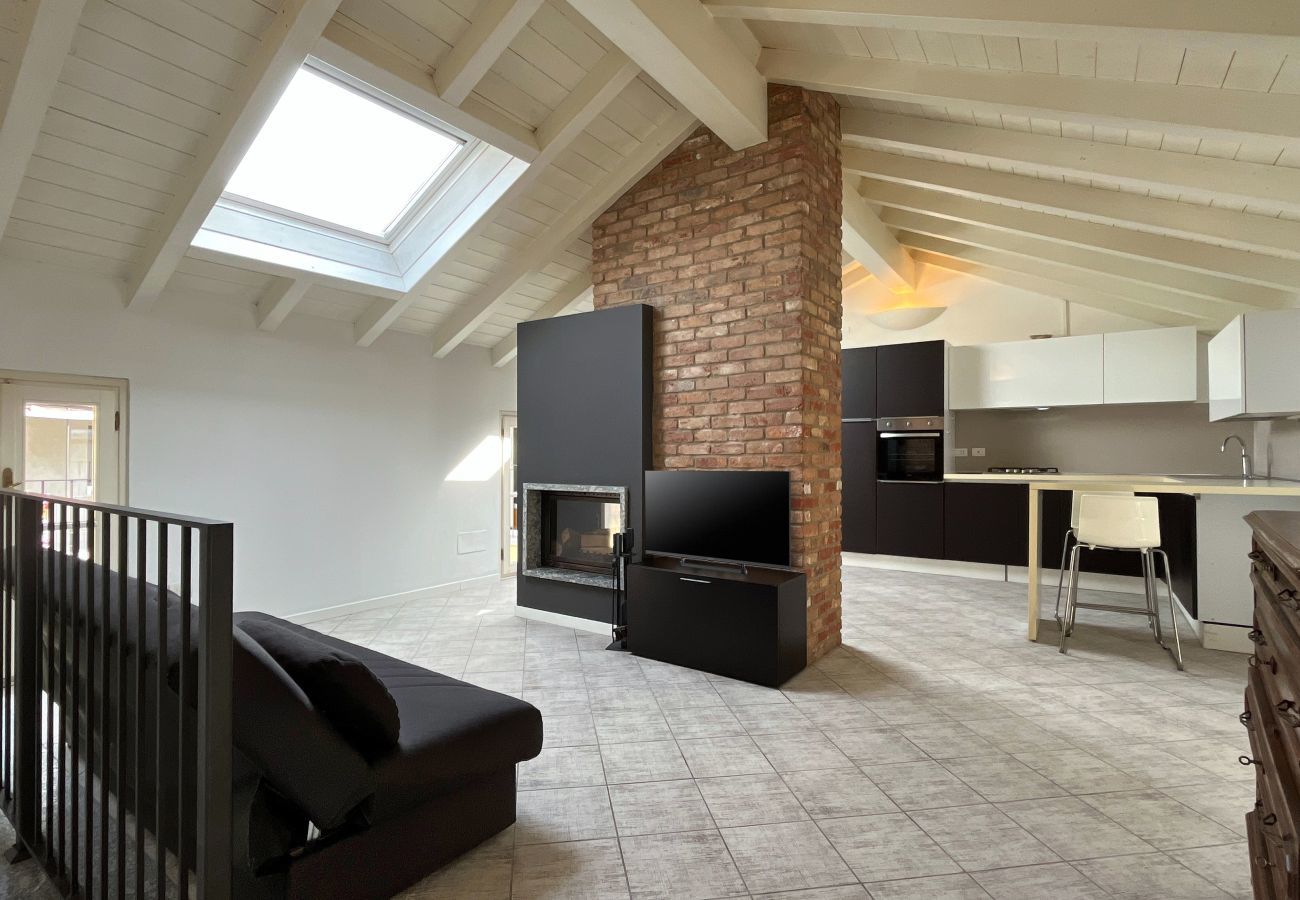 Elegant and bright living room with balcony access and bathroom  Bright open-plan living room